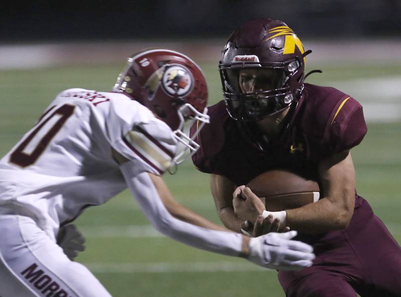Richmond-Burton's Nick Falasca, right, runs into the end zone as Morris’ Sam Mateski tries to tackle Falasca during a Kishwaukee River Conference / Interstate 8 Conference crossover football game Friday, Sept. 30, 2022, between Richmond-Burton and Morris at Richmond-Burton Community High School in Richmond.
