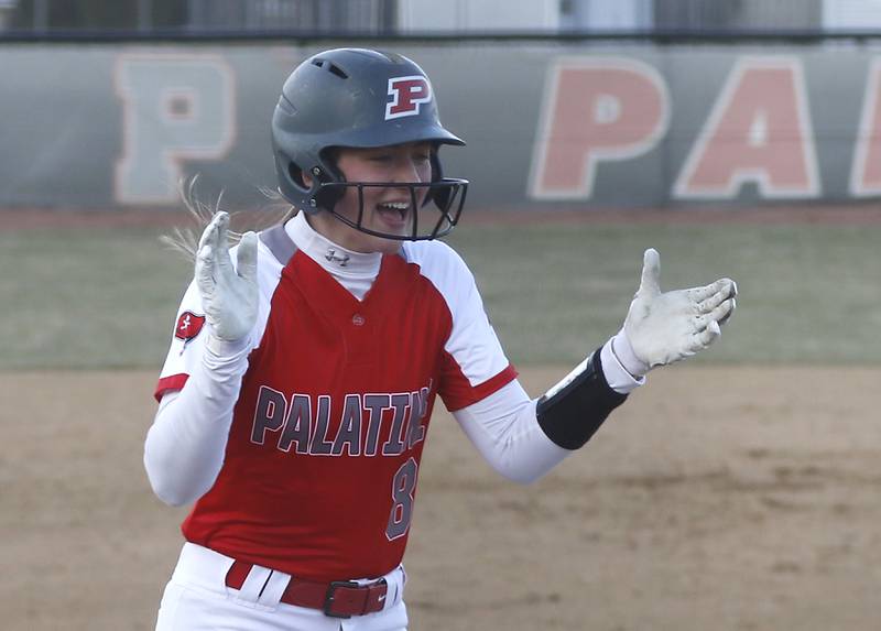 Palatine’s Jolie DeValk celebrates a grand slam home run as she runs the bases during a non-conference softball game against Jacobs Monday, March 20, 2023, at Palatine High School.