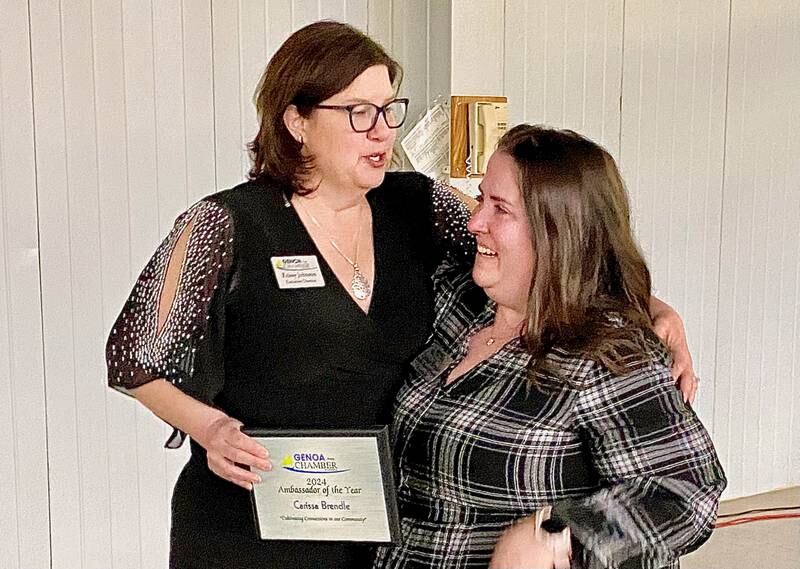 Krissy Johnson (left), executive director of the Genoa Area Chamber of Commerce, presents Carissa Brendle with the chamber's 2024 Ambassador of the Year Award on Thursday, Feb. 13, 2025, at the chamber's 68th Annual Meeting and Awards Dinner at Custom Aluminum Products, 312 Eureka St., Genoa.
