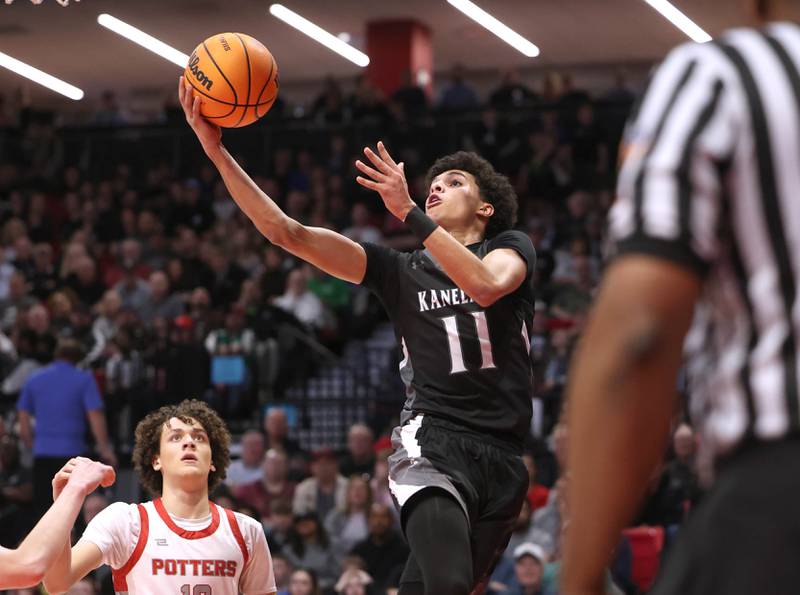 Kaneland's Evan Frieders gets to the basket in front of Morton's Brendan Petty Monday, March 9, 2026, during their IHSA Class 3A supersectional matchup in the Convocation Center at Northern Illinois University in DeKalb.