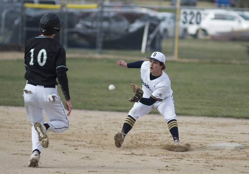 Sterling's Colt Adams waits for the throw before tagging out Alleman’s Chance Carruthers trying to steal second Tuesday, April 5, 2022.
