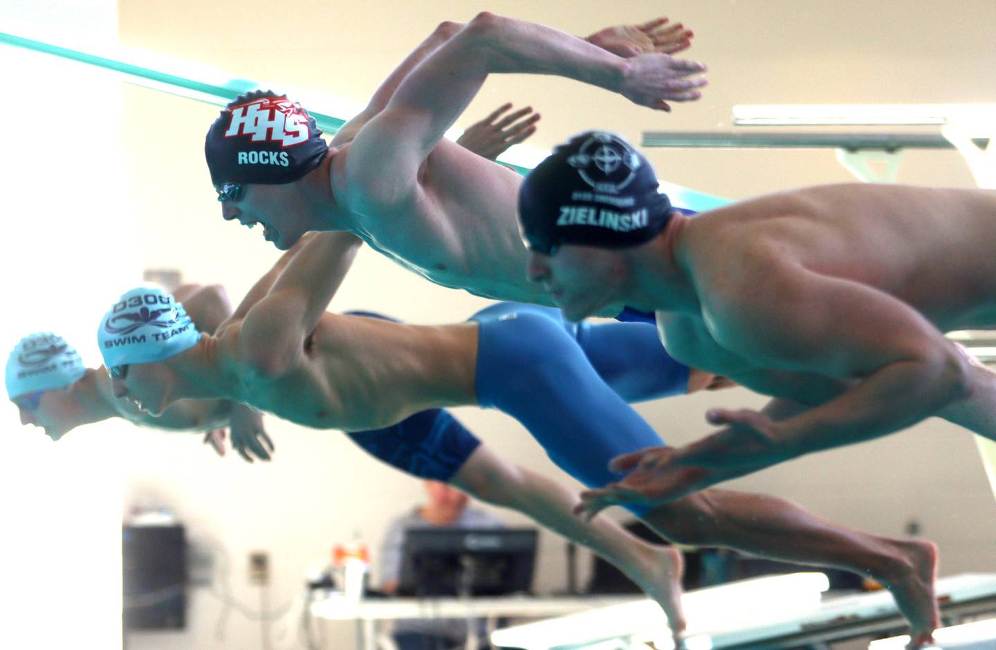 Huntley’s Benjamin Rocks launches to the start of the 50-yard freestyle at the Fox Valley Conference Boys Swimming Invite at Woodstock North on Saturday.