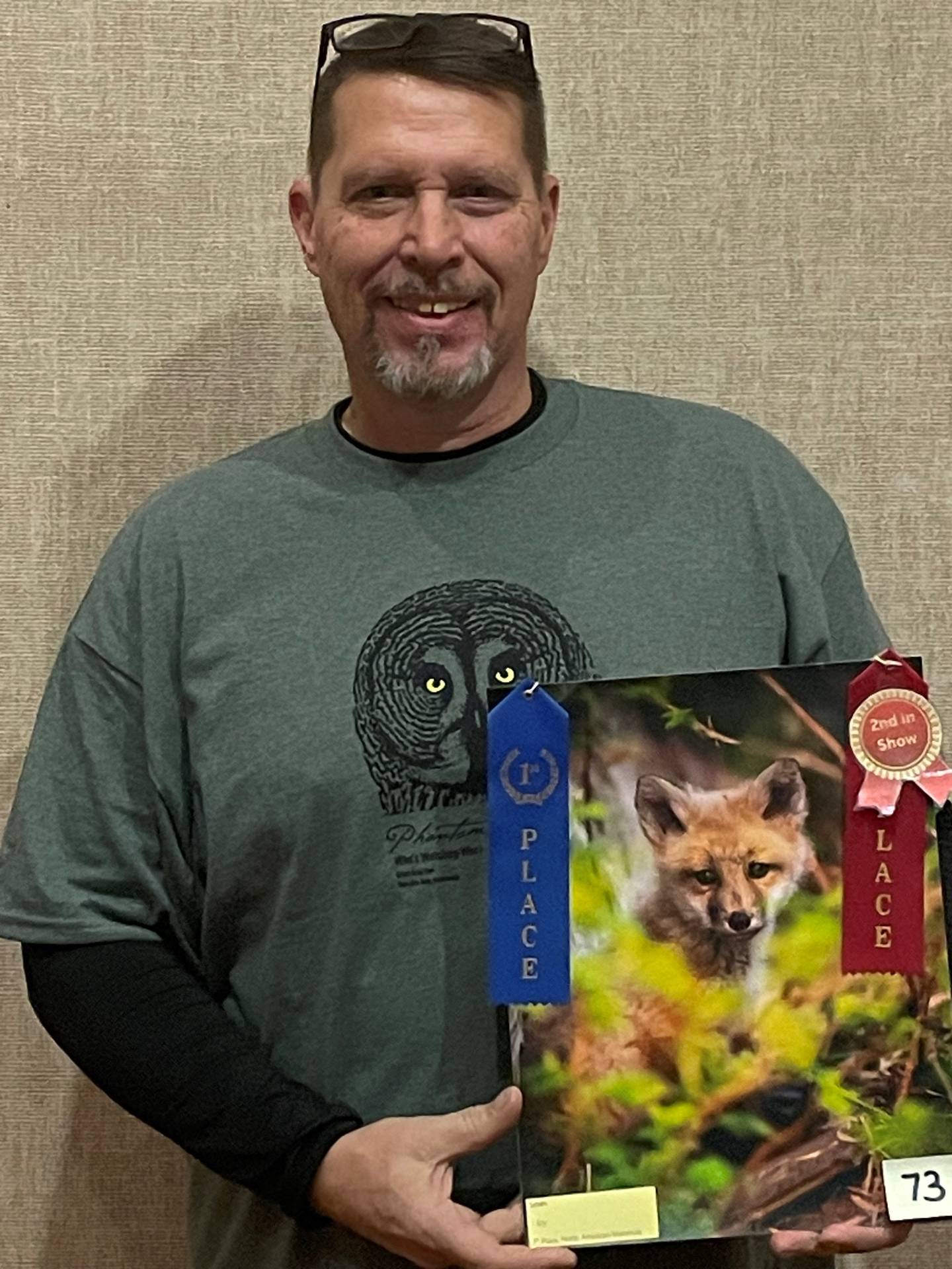 Phillip Smith was second place best in show at the Starved Rock Photography Show. He is displaying his photo “I Spy”
of a red fox kit.