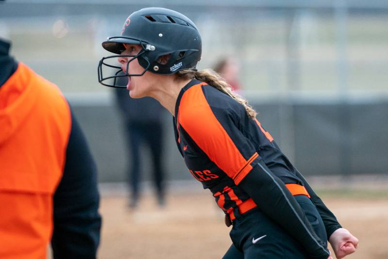 St.Charles East's Hayden Sujack (21) reacts after beating out a throw to first for a single against Yorkville during a softball game at St.Charles East High School on Wednesday, Mar 22, 2023.