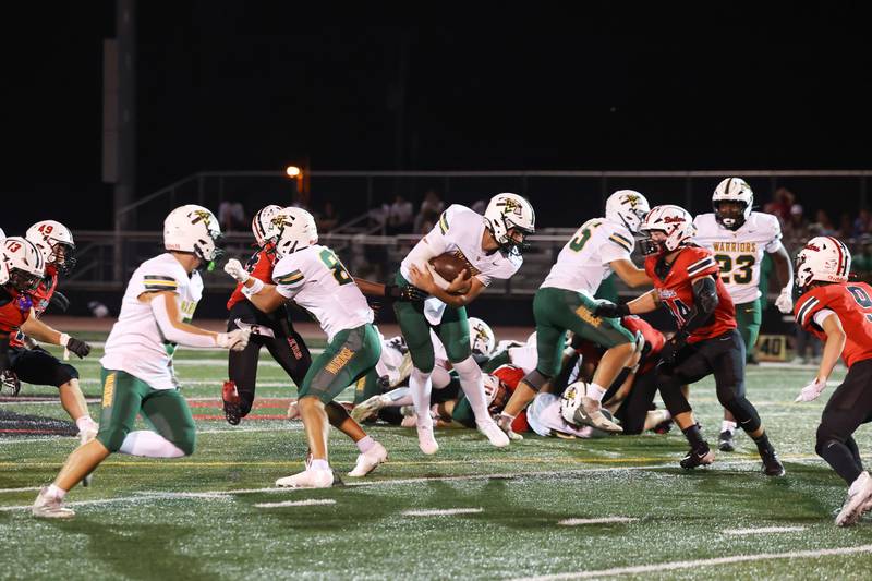 Waubonsie Valley quarterback Colin Ford attempts a run during the Warriors' 35-6 loss to Bradley-Bourbonnais on Friday, Sept. 12, 2025.