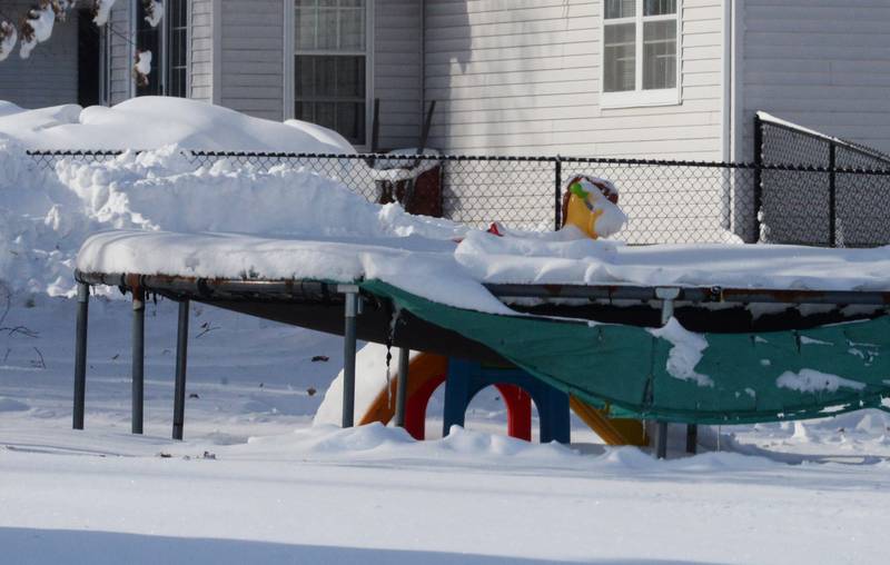 A trampoline in Forreston's is laden with snow on Monday, Jan. 15, 2024 following Friday and Saturday's winter storm that dropped an estimated 10-12 inches of snow across the region. Frigid temperatures followed the snow with nighttime lows hitting -14.
