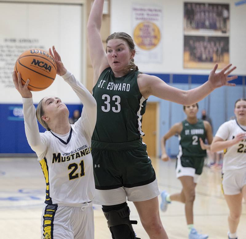 Yorkville Christian’s Danielle Bulson puts up a shot against St. Edward’s Maggie Jarzemsky Tuesday, Feb. 25, 2025, in the Class 1A Sectional at Hinckley-Big Rock.
