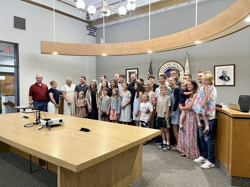 Dixon's new chief of police Ryan Bivins (middle) poses for a photo with his large extended family who came to Monday's Dixon City Council meeting, June 2, 2025, to celebrate Bivins being sworn into the role.