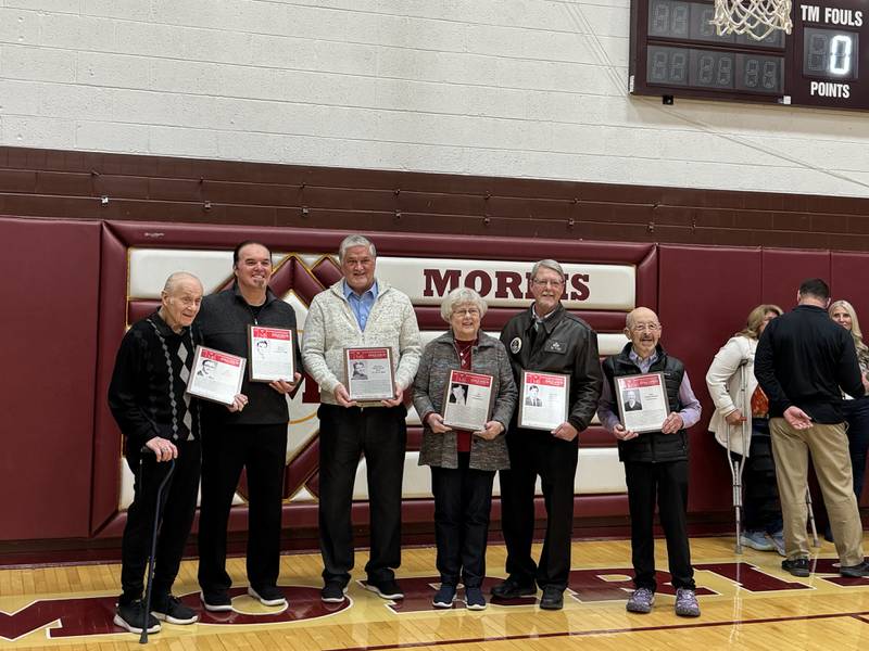 (From left) Ed Spiezio, Scott Spiezio, Scott Belt accepting on behalf of Delight Belt, Patty Feeney accepting on behalf of Jim Feeney, Col. William Fruland, and Kim DesLauriers.