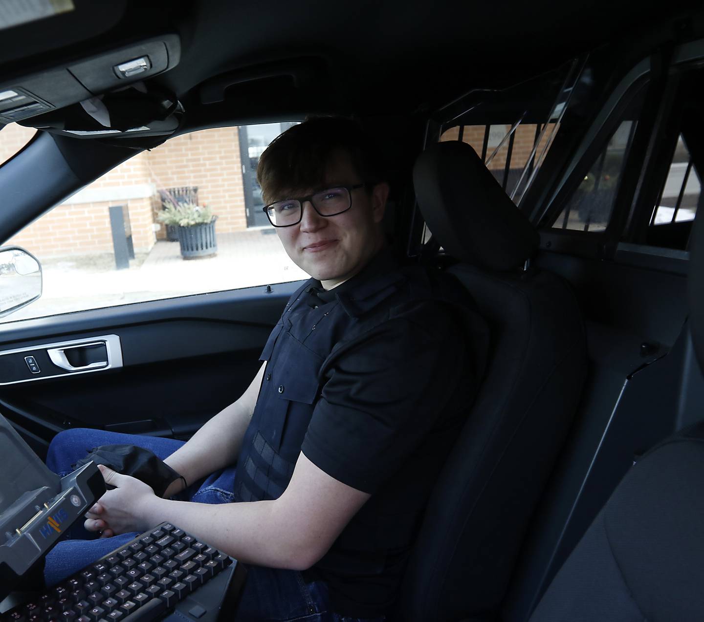 Drake Rueckemann, 18, prepares to start a ride-along with the McHenry Police Department, Monday, Feb 14, 2022, at the police department. Rueckemann, who is a senior at McHenry High School, is taking part in an internship program as part of the school’s new Social Science class.