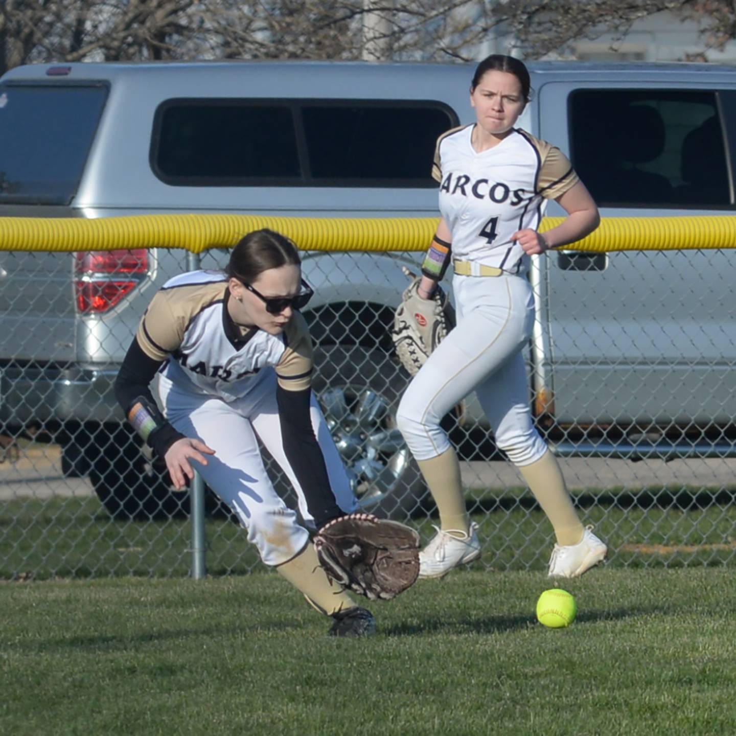 Polo left fielder Makayla Cisketti fields a hit as centerfielder Cheyenna Wilkins backs her up against Warren-Stockton on March 28, 2024 at Westside Park in Polo.