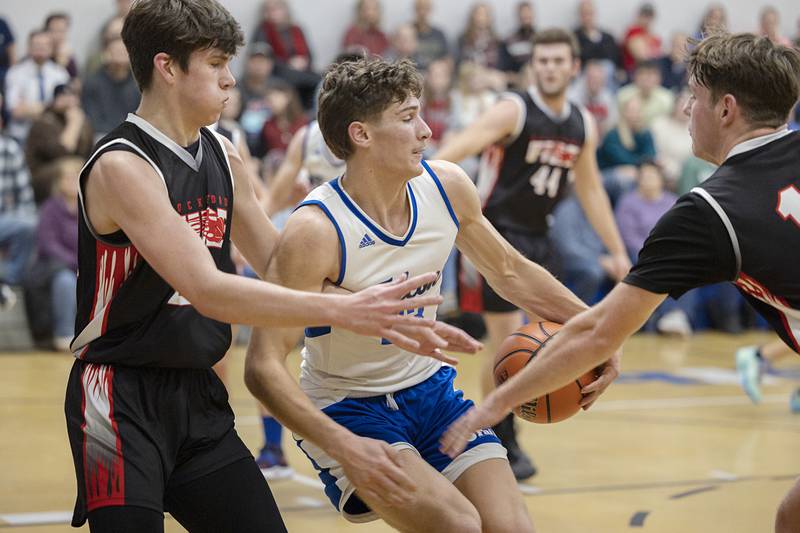 Faith Christian’s Levi Schuler spins in the lane Thursday, Dec. 15, 2022 while playing Rockford Fire.