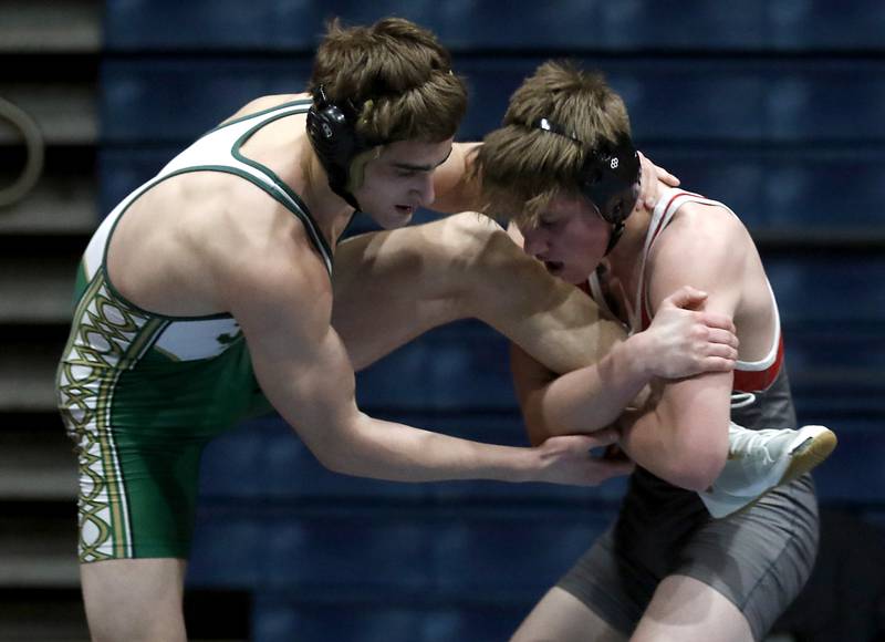 Marian Central's Ethan Struck tries to take down St. Patrick's Devin Nichol in their 160-pound wrestling match Thursday, Jan. 19, 2023, at Marian Central High School in Woodstock.
