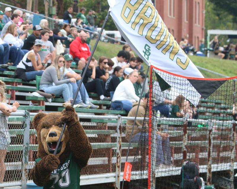 St. Bede mascot waves the Bruin flag after scoring the only touchdown against Marquette in the third quarter on Saturday, Sept. 28, 2024 at St. Bede Academy.