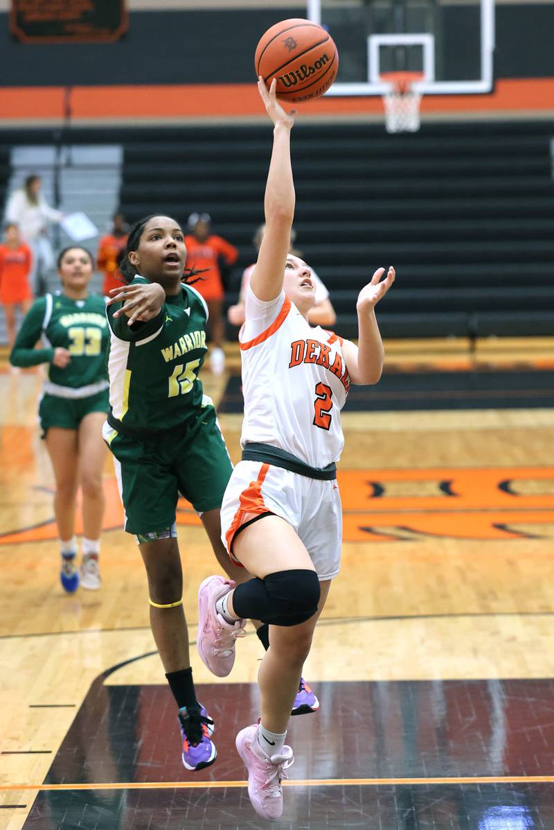 DeKalb's Ella Medina gets a layup in front of Waubonsie Valley's Taylor Curry during their game Thursday, Dec. 15, 2022, at DeKalb High School.