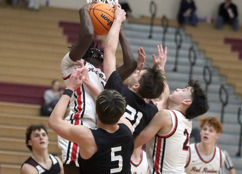 Huntley’s Sheldon Aninagyei Bonsu snags a rebound in a flurry of players against Prairie Ridge in varsity boys basketball on Tuesday, Feb. 18, 2025, at  Huntley High School in Huntley.