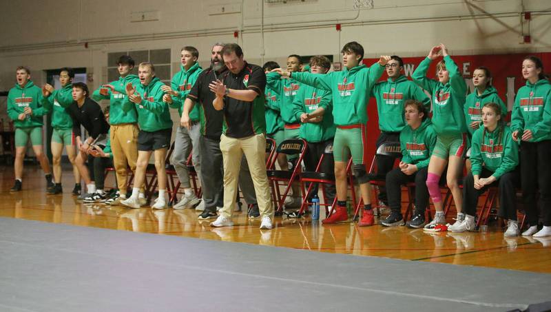 Members of the L-P wrestling team cheer on teammate Zach Pocivasek on Thursday, Jan. 9, 2025 in Sellett Gymnasium at L-P High School.