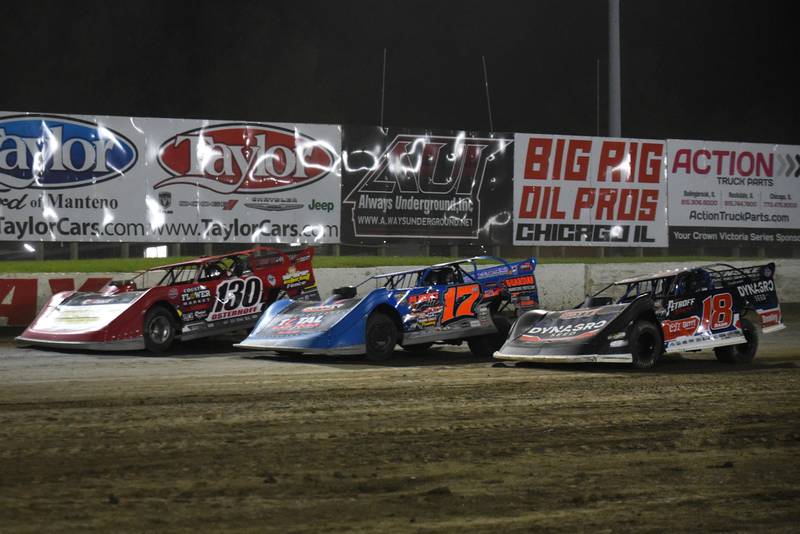 From left, Chase Osterhoff, Brenden Smith and Shannon Babb race down the backstretch during the DIRTcar Summer Nationals late model feature at Kankakee County Speedway Wednesday, June 11, 2025.