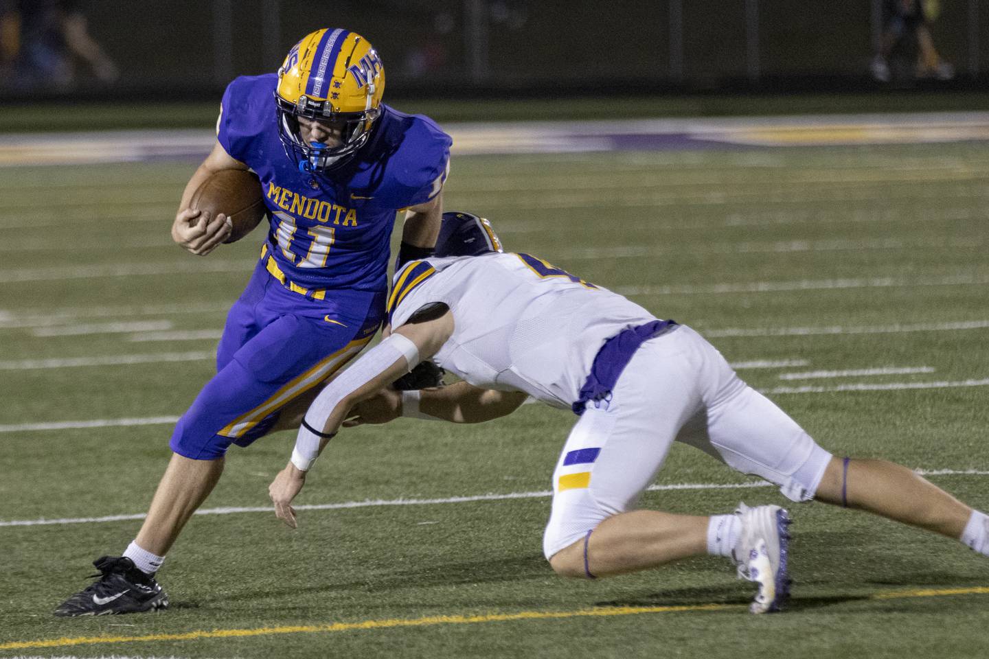 Aden Tillman gets out and around a Sherrard defender during the game at Mendota High School on September 27, 2024.