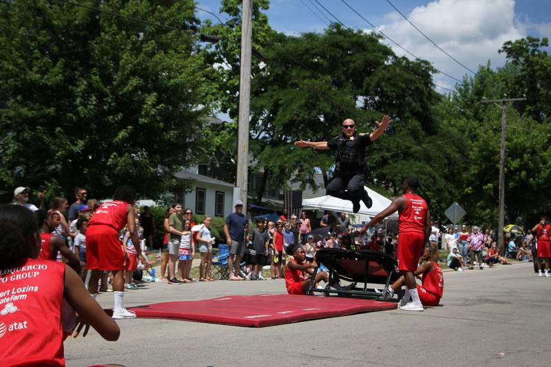 Crystal Lake police Sgt. Dan Hulata jumped with the Jesse White Tumblers during the parade Sunday, July 3, 2022. Hulata has been with the department 28 years.
