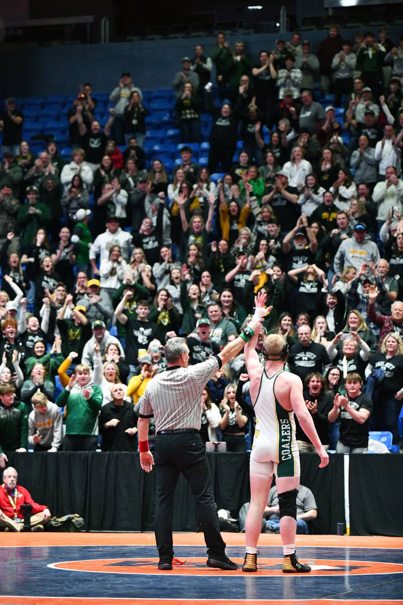 Cade Poyner of Coal City celebrates with the crowd after his 190-pound match victory over Ross Miller of Vandalia during the IHSA Dual Team State Finals in Bloomington on Saturday, March 1.