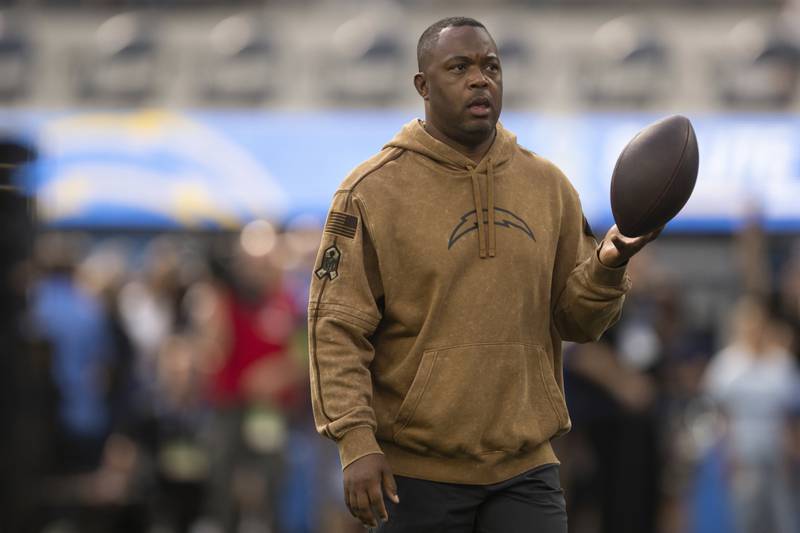 Former Los Angeles Chargers wide receivers coach Chris Beatty walks on the field before a game against the Detroit Lions, Sunday, Nov. 12, 2023, in Inglewood, Calif.