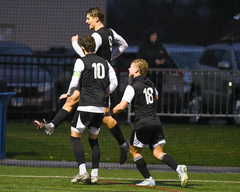Prairie Ridge's Henry Knoll, center, celebrates a goal while taking on Benet Academy during the class 2A super sectionalsoccer match on Tuesday Nov. 5, 2024, held at Wheaton Academy in West Chicago.