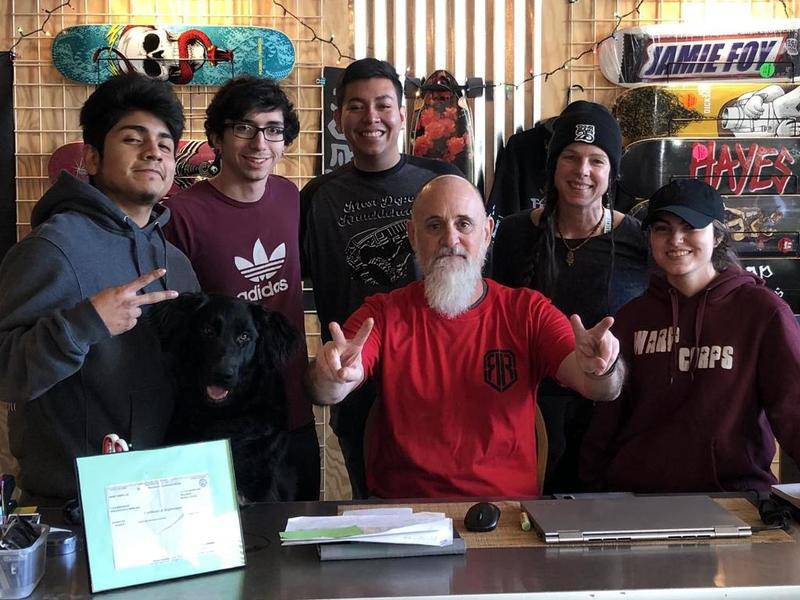 Warp Corps. owner Rob Mutert poses with employees at the Woodstock skate and coffee shop. Warp Corps. Warp Corps. partners with substance abuse and mental health awareness leaders including McHenry County's Live4Lali to provide recovery services and artistic outlets to the Woodstock area.