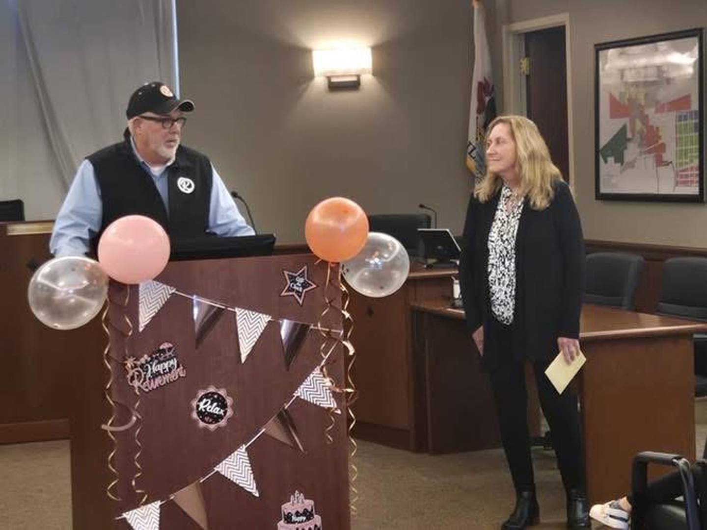 Mayor John Bearrows (left) speaks in honor of retiring City of Rochelle Finance Director Chris Cardott (right).