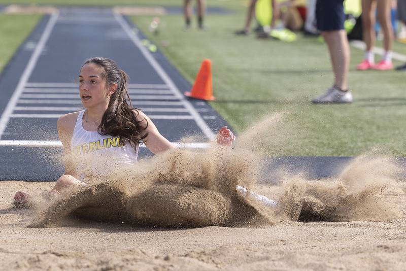 Sterling’s Alice Sotelo lands her triple jump attempt Thursday, May 11, 2023 at the class 2A Sterling girls track sectionals. Sotelo qualified to defend her triple jump state title.