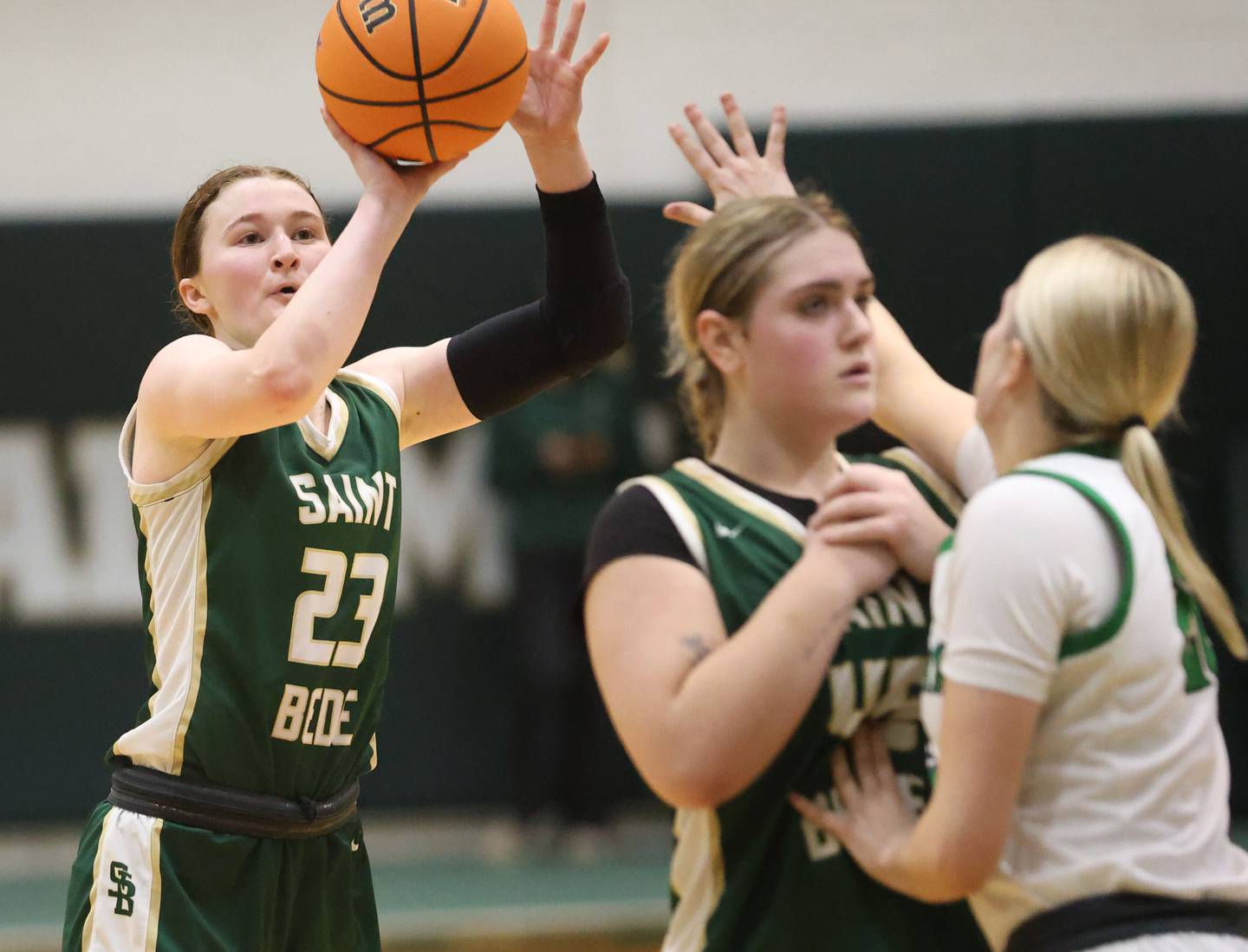 St. Bede's Lili McClain shoots a jump shot as teammate Savannah Bray blocks out Alleman's Megan Hulke during the Class 2A Regional finals on Thursday, Feb. 19, 2026 at St. Bede Academy.