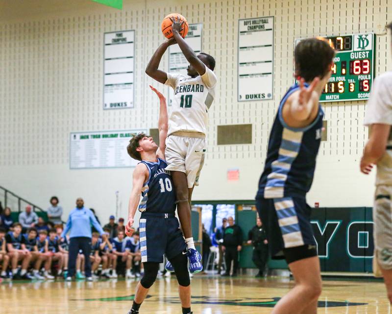 Glenbard West's Josh Abushanab (10) attempts a desperate last shot during their Jack Tosh Holiday Classic basketball tournament game between Nazareth vs Glenbard West. Thursday Dec 26, 2024 in Elmhurst.