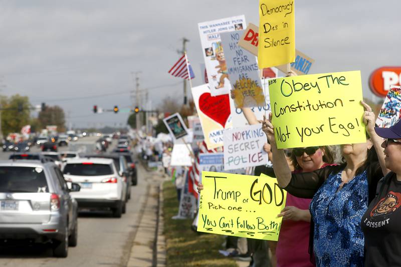 Protesters line Route 31 during a "No Kings” protest rally on Saturday, Oct. 18, 2025, in McHenry. The protest drew thousands of protesters to the area to protest the policies of President Donald Trump.