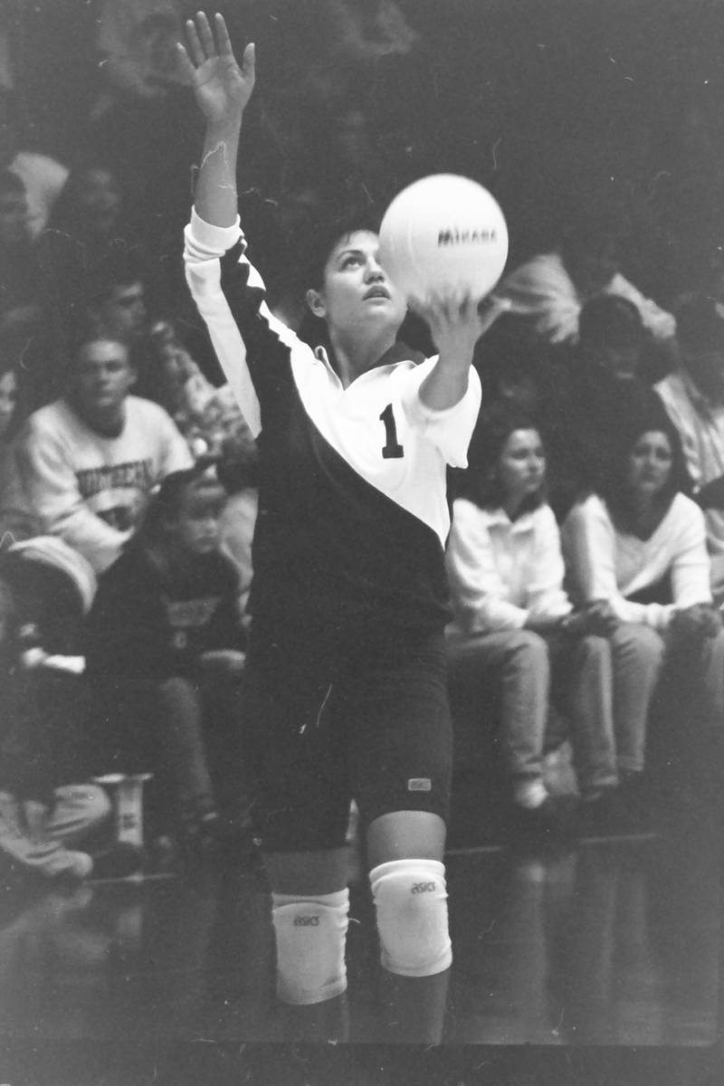 Princeton's Nicole Coates prepares to serve for the Notre Dame Irish against Northern Illinois at Chick Evans Fieldhouse in Dekalb in the early '90s. She was an all-state player at Princeton and still holds the school all-time kills record.
