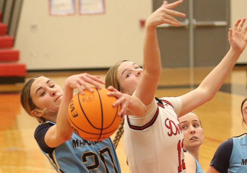 Marquette's Kaitlyn Davis grabs a rebound over Halll's Leah Pelka on Thursday, Feb. 13, 2025 at Hall High School.