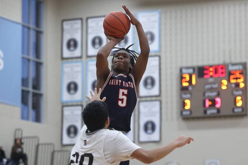 St. Viator’s Dayton Ellis takes the jump shot against Joliet Catholic.