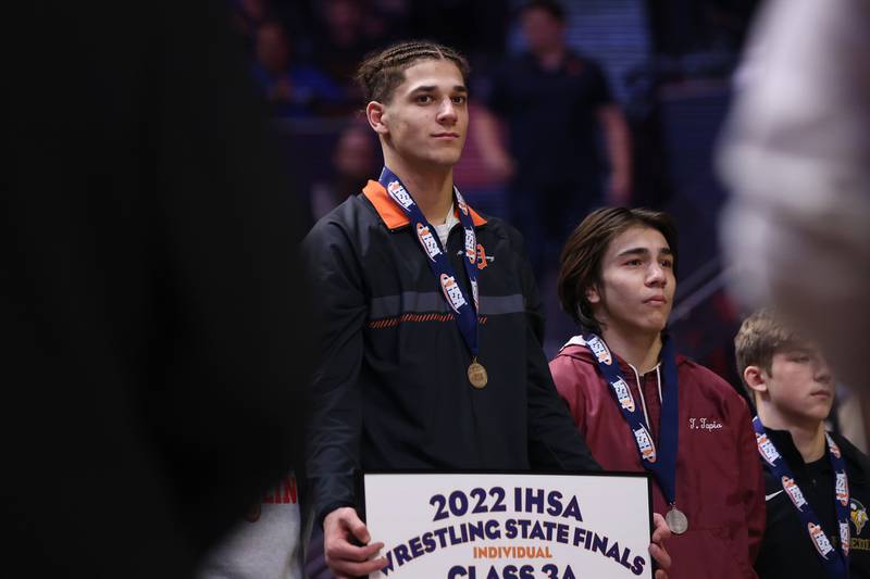 Dekalb’s Tommy Curran takes the podium as the Class 3A 145lb. champion at State Farm Center in Champaign. Saturday, Feb. 19, 2022, in Champaign.