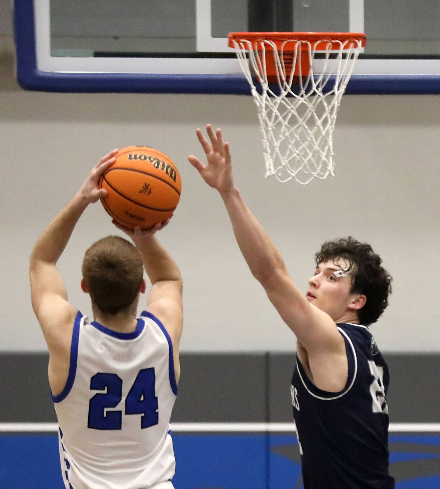 Cary-Grove's Adam Bauer (right) tries to block the shot of Burlington Central's Bennek Braden during a Fox Valley Conference boys basketball game on Friday, February. 6, 2026, at Burlington Central High School.