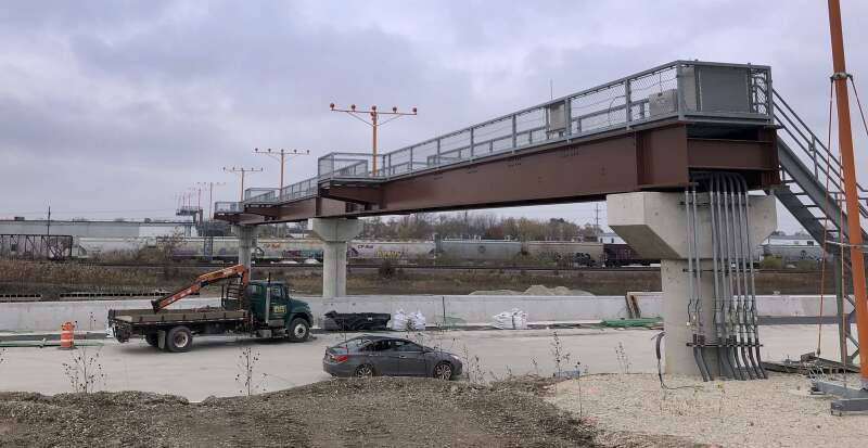 Work continues on the new I-490 toll road on the western edge of O'Hare International Airport. In the distance is Irving Park Road and above is a bridge for relocated runway approach lights.