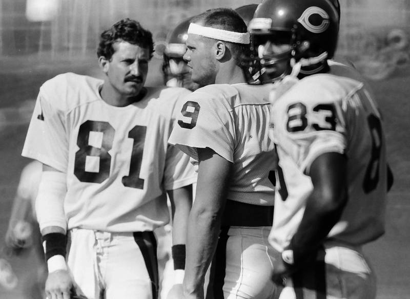 Chicago Bears players (from left) James Maness (81) Jim McMahon and Willie Gault converse during training camp on Wednesday, June 12, 1985 in Platteville Wis.