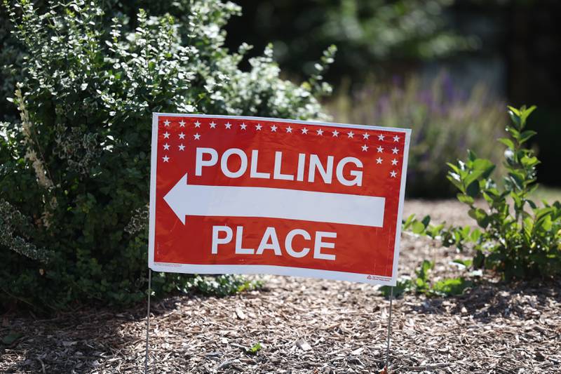 A sign for the entrance to vote sits outside Lincoln-Way Central High School for the General Primary Elections on Tuesday. Tuesday, June 28, 2022 in New Lenox.