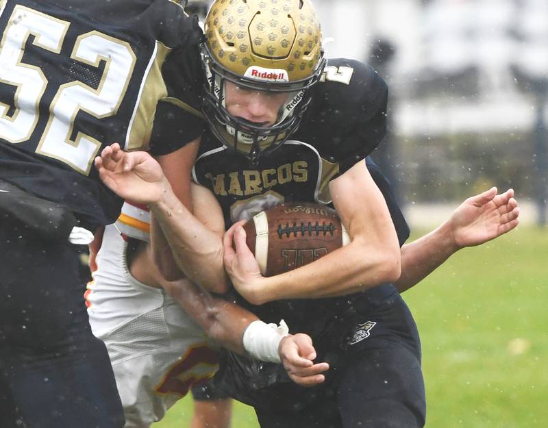 Polo's JT Stephenson (2) battles for yards against St. Anne during I8FA playoff action on Saturday, Nov. 8, 2025 at Polo High School.