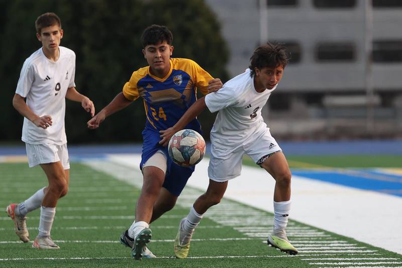 Joliet Catholic’s Jiuliani Verdin works past Joliet Central’s Nicolás Garzon on Monday, Sept. 9, 2024 in Joliet.