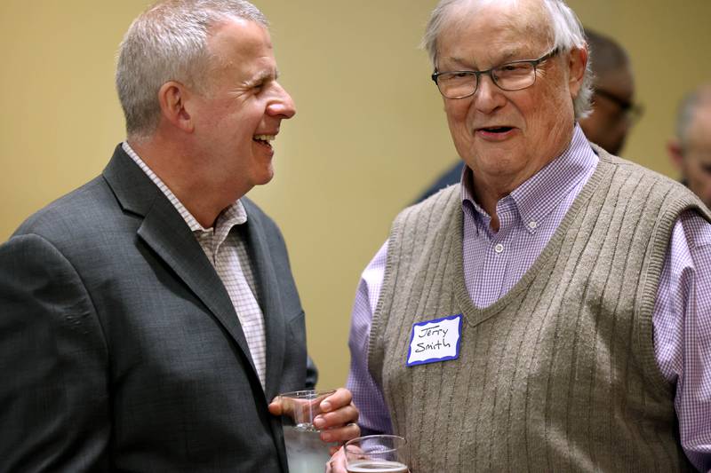 DeKalb Mayor Cohen Barnes, who is running for reelection, and former mayor Jerry Smith share a laugh Tuesday, April 1, 2025, during an election night watch party at Faranda's Banquets in DeKalb.