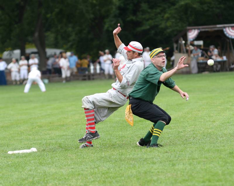 Oregon Ganymede Kevin "The Kid" Stafford slips by a Canton fielder to get to third base safely at the 21st Annual World Tournament of Historic Base Ball in Dearborn, Michigan on Saturday, Aug. 10, 2024.