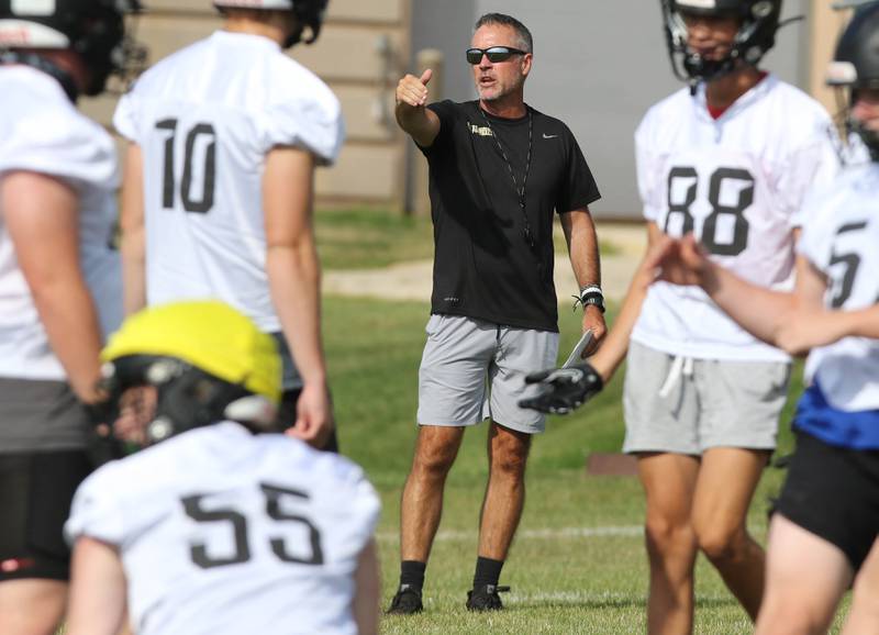 Sycamore head coach Joe Ryan instructs his team during practice Monday, Aug. 7, 2023, at Sycamore High School.