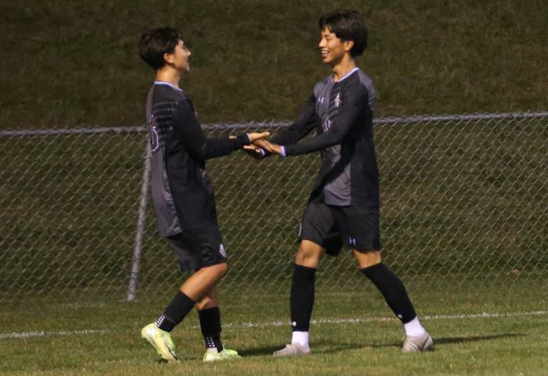 Kankakee's Yael Calderon and Angel Cruz hi-five each other after scoring a goal against Ottawa during the Class 2A Regional semifinal game on Monday, Oct. 20, 2025 at Ottawa HIgh School.