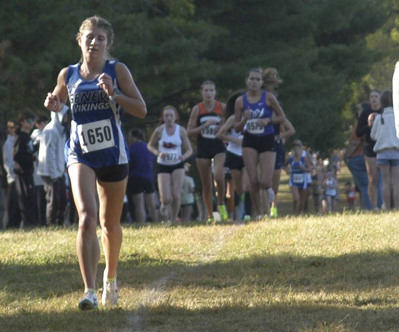 Sophia Borter of Geneva  cones up the long climb with Daniela Lovett of Dixon behind her. Local High School teams gathered at Hoover Park in Sterling for the Rock River Run, held on Saturday, September 27, 2025.