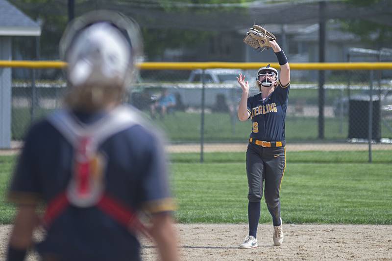 Sterling’s Lauren Jacobs puts the squeeze to pop-up against Rock Falls Saturday, May 14, 2022.