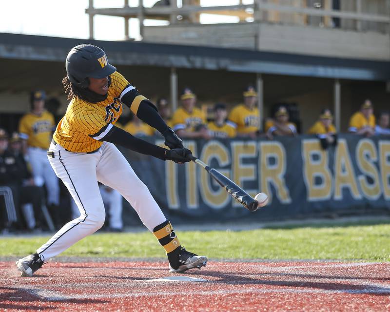 Joliet West's Deon McNair (0) connects on a pitch during varsity baseball game between Oswego East at Joliet West.  April 10, 2023.